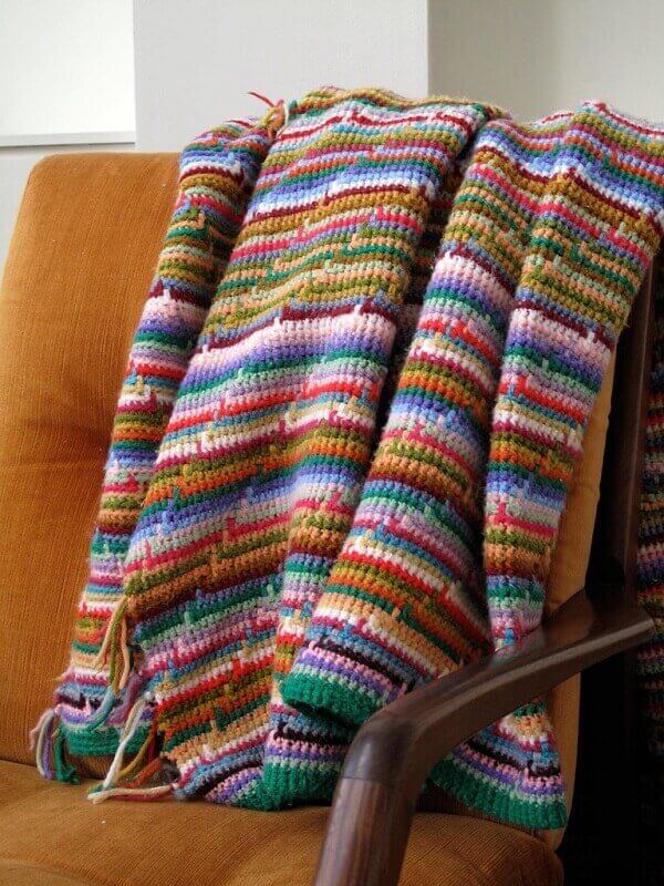 Colorful sofa blanket made in Tunisian crochet