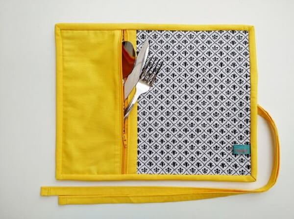 Mini fabric placemat with yellow cutlery holder