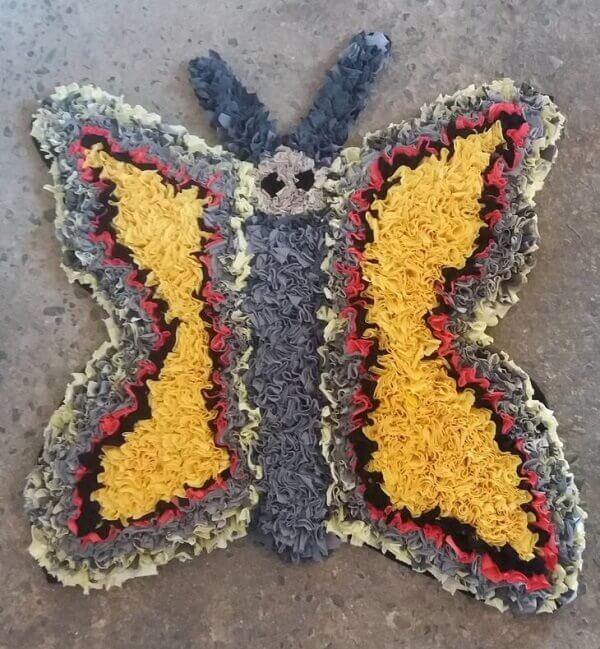 Patchwork carpet in the shape of a butterfly