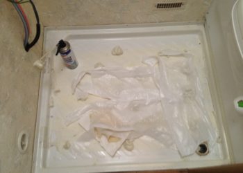 How do you fix a cracked shower tray in a caravan?