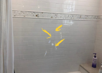 hairline crack in shower wall tile