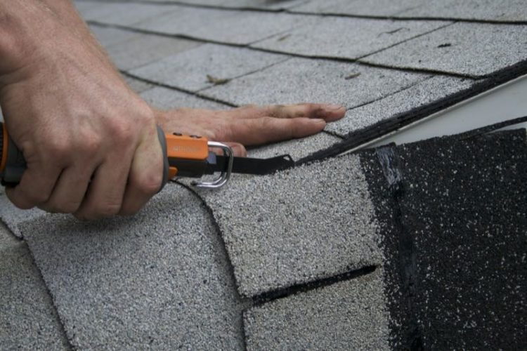 What is the best way to cut roofing shingles?