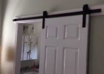 How do you lock a bathroom barn door?