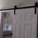 How do you lock a bathroom barn door?