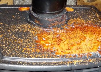 How do you remove rust from a wood burning stove?