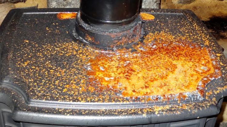 How do you remove rust from a wood burning stove?
