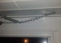 How do you put a safety chain on a storm door?
