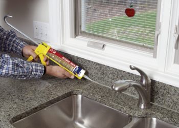 applying silicone sealant kitchen
