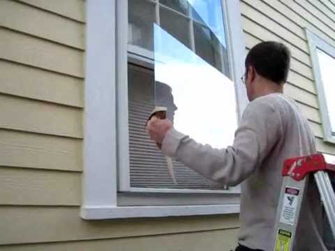 How do you replace a broken window pane in a metal frame?