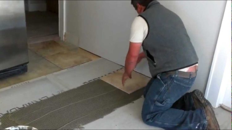 How do you lay ceramic tile on a concrete floor?