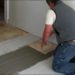 How do you lay ceramic tile on a concrete floor?