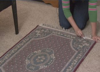 How do I stop my outdoor rug from blowing?