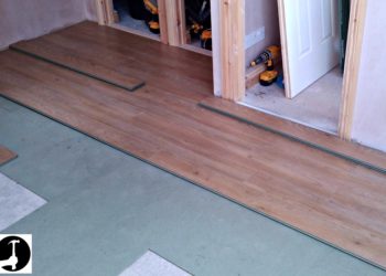 Where do u start when laying laminate flooring?