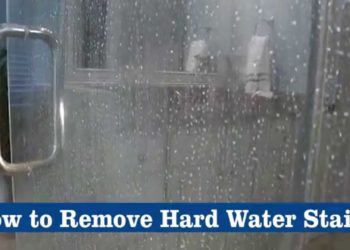 What removes hard water stains from glass shower doors?