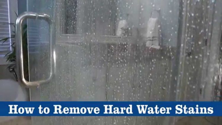 What removes hard water stains from glass shower doors?
