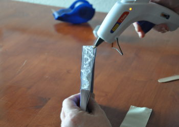 How do you glue a book binding back on?