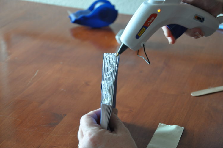 How do you glue a book binding back on?