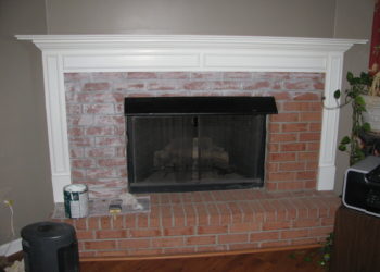 distressed white brick fireplace
