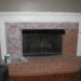 distressed white brick fireplace
