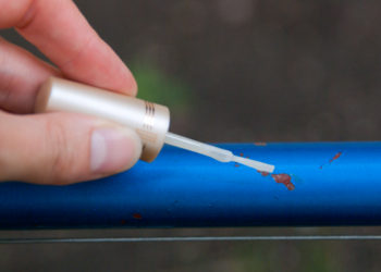 How do you touch up a motorcycle frame?