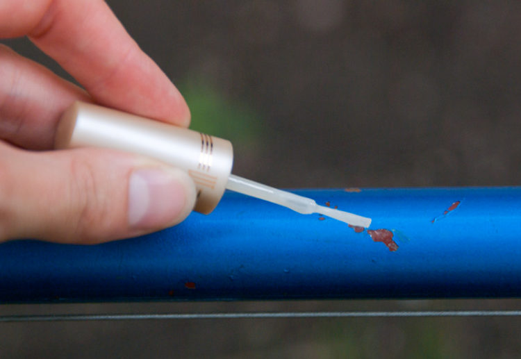 How do you touch up a motorcycle frame?