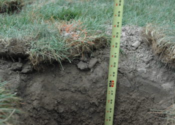 How deep should metal fence posts be set?