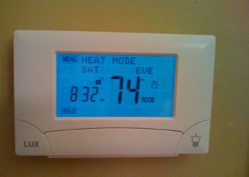 How do I reset my Lux tx9000ts thermostat?