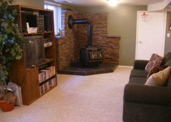 What should I put on the wall behind my wood stove?