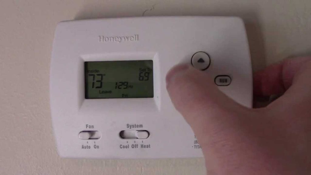 How do I override my Honeywell programmable thermostat?