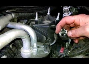 How do you remove a Ford hose connector?