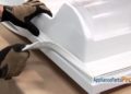 How do you replace a refrigerator door gasket on a Whirlpool refrigerator?