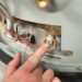 how to replace reset button on water heater