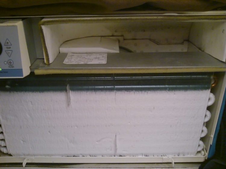 How do I stop my window air conditioner from freezing up?