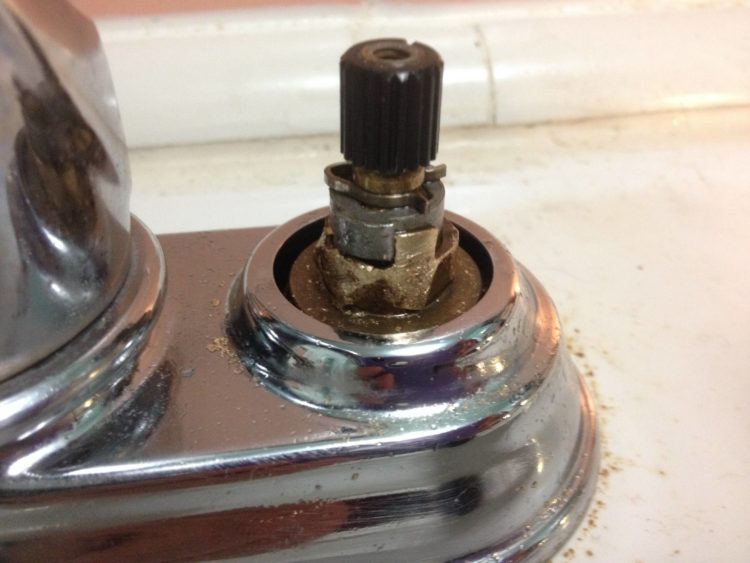 How do I remove a stuck Kohler shower cartridge?
