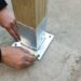 how to anchor fence post to house