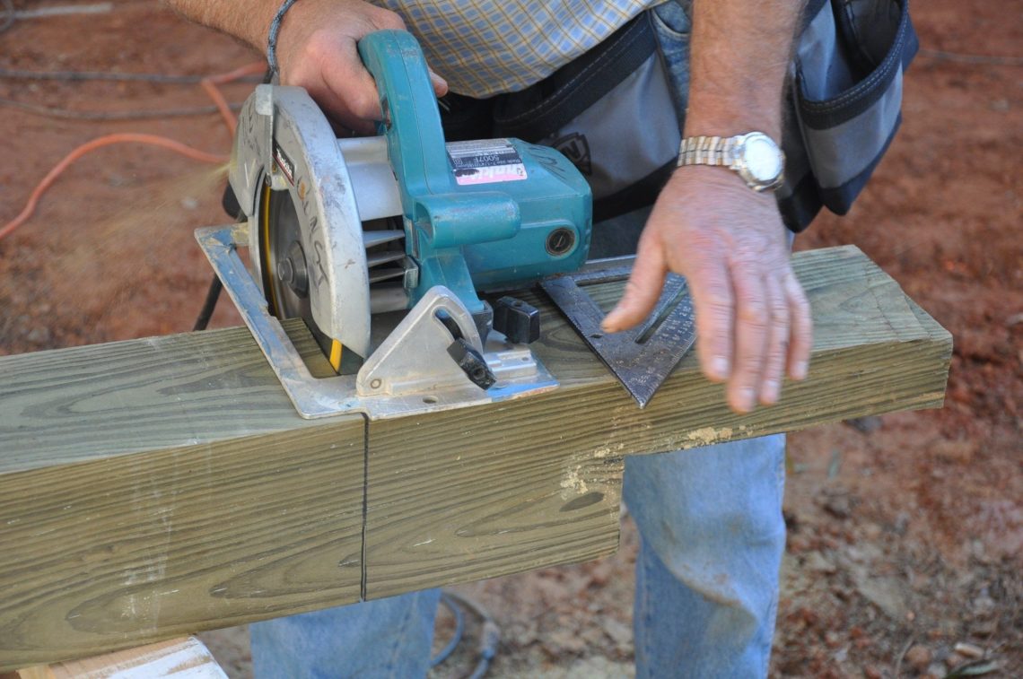 How do you attach a 6x6 post to a deck?