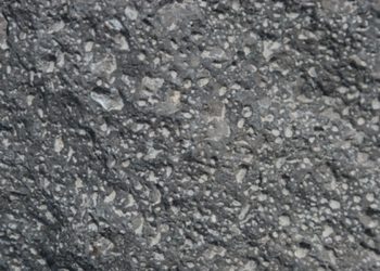 How many square feet are in a ton of asphalt?