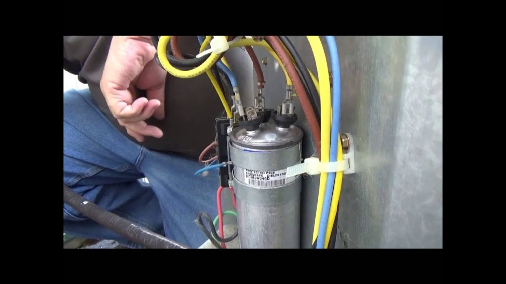 How do you change a capacitor on an outside AC unit?
