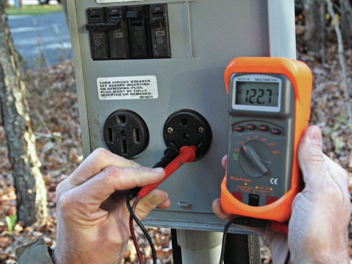 How do you check household voltage with a multimeter?