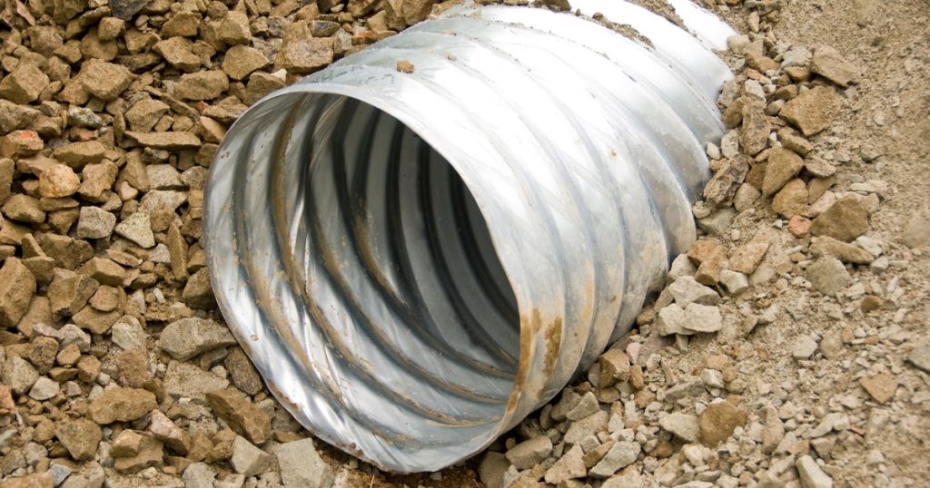 How do you clear outside drain pipes?