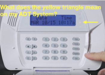 What does the yellow trouble light on my DSC keypad mean?