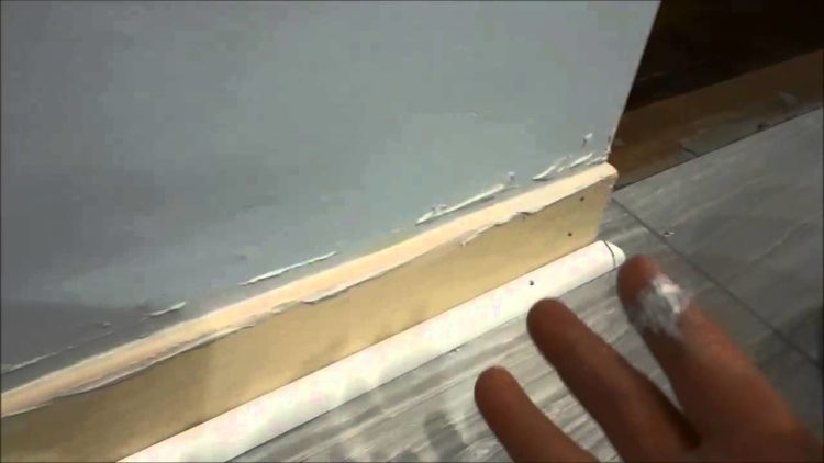 how to fill gap between baseboard and wall
