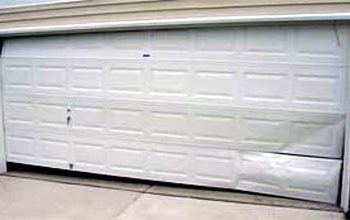 How do you fix a bent garage door panel?
