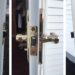 How do I change the lock on my storm door?