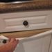 How do you fix peeling laminate on kitchen cabinets?