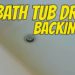 tub backing up