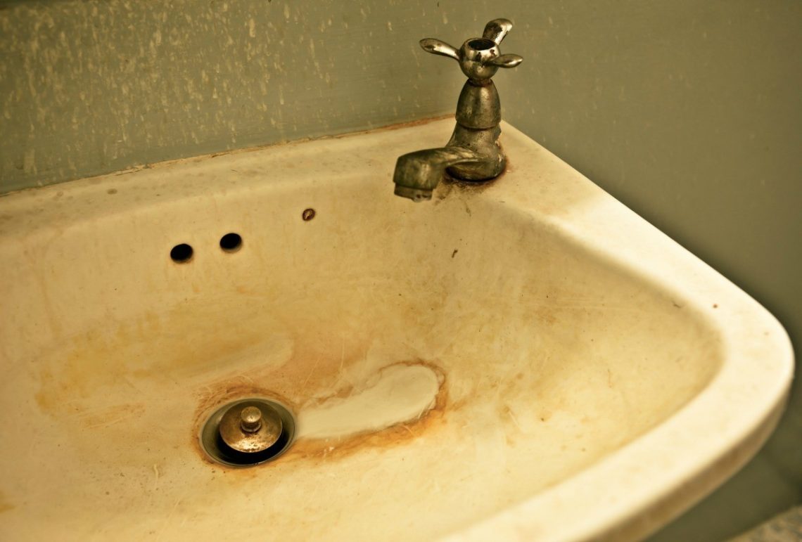 How do you get rust stains out of a porcelain sink?