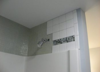 can you install shower panels over tile