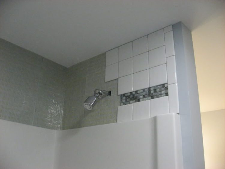 can you install shower panels over tile