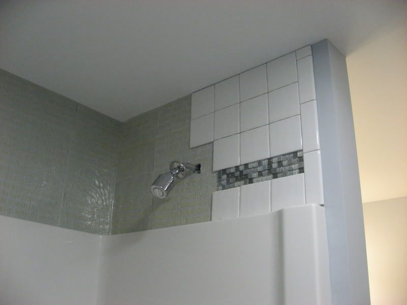 How do you install a shower surround over existing tile?